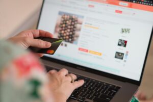 pexels-photo-11952301-11952301 Engaging in online shopping using a credit card with a laptop for convenience and ease.