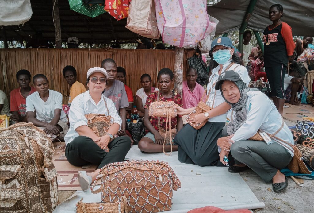 A bustling market in Agats, Papua, showcasing traditional woven crafts and community life.